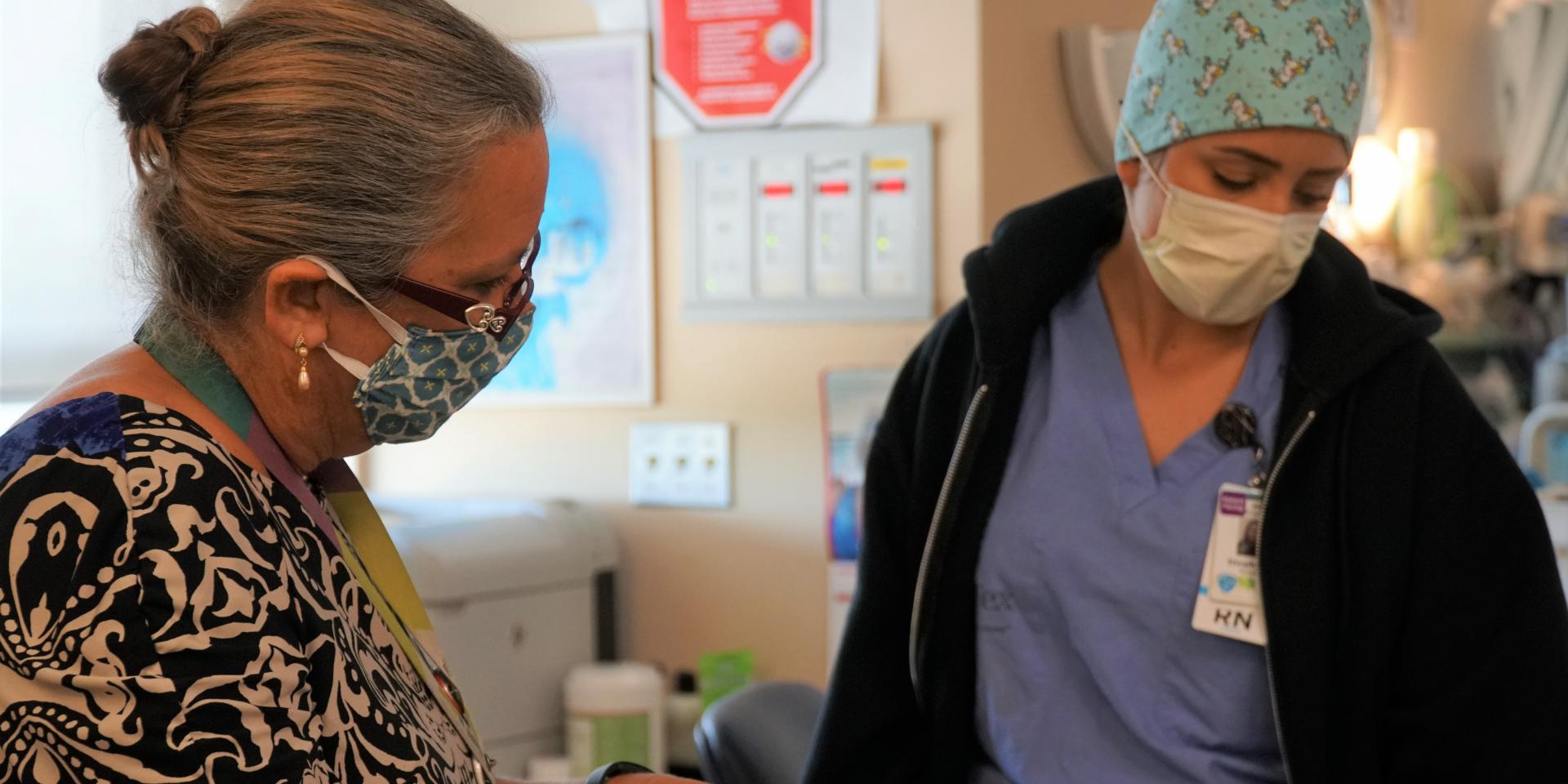 Registered nurse Stephanie Ramalho answers questions from mock surveyor Janice Ward during Rock the Mock.