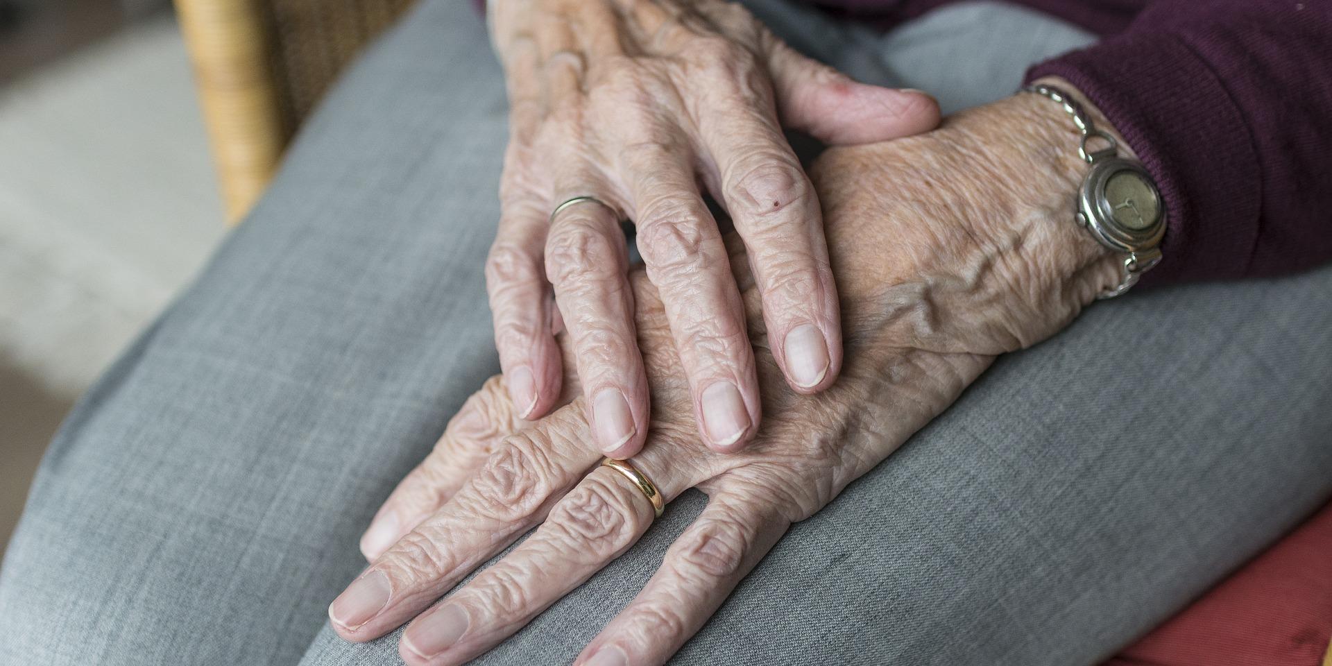 Elderly person sitting in chair 