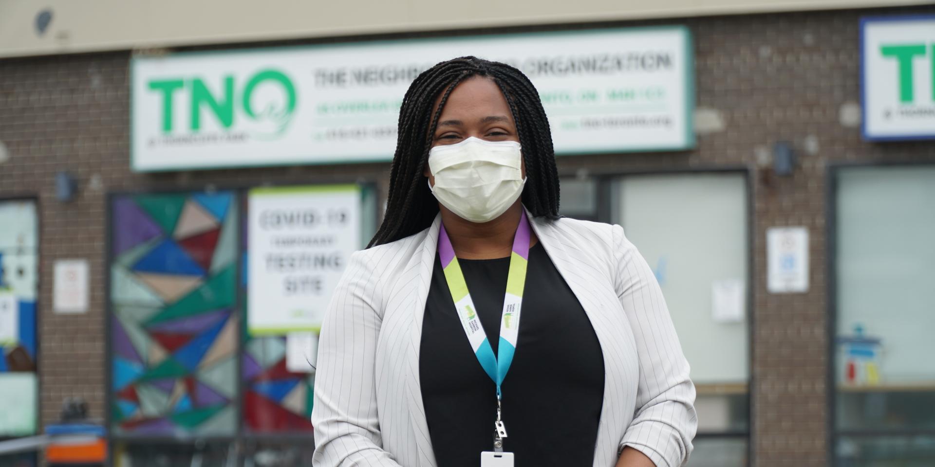 Jennifer Sampson poses outside the pop-up COVID-19 testing site in Thorncliffe Park.