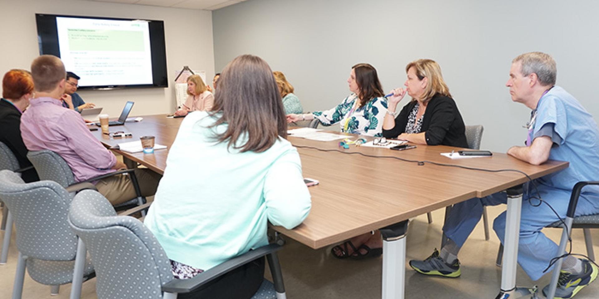 MGH staff and physicians at a daily safety check meeting