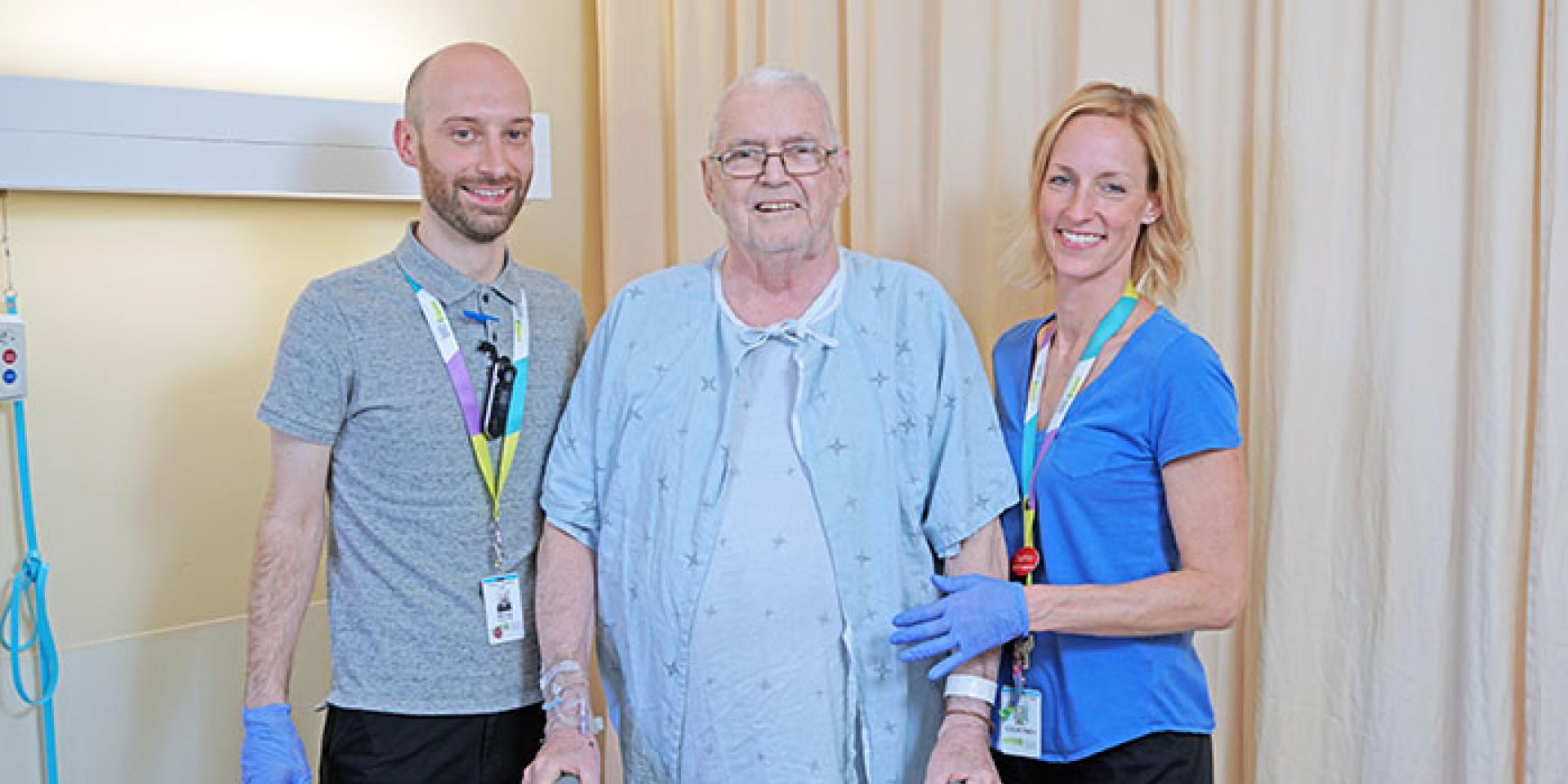 Edward Hammet exercising with MGH physiotherapist Moray Wright-Whyte and physiotherapist assistant, Courtney Gray.