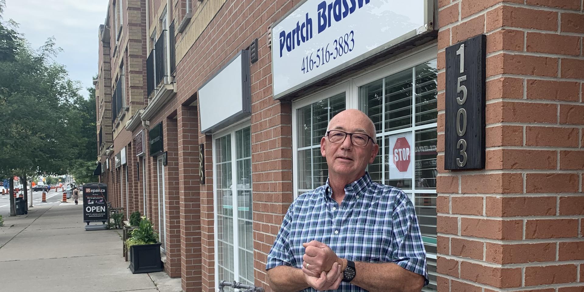 Ron Partch outside his store, Partch Brasswinds