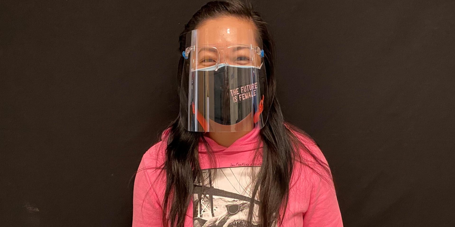 Lisa Tsue, an educator at Grenoble Public School, is photographed wearing a mask and face shield.