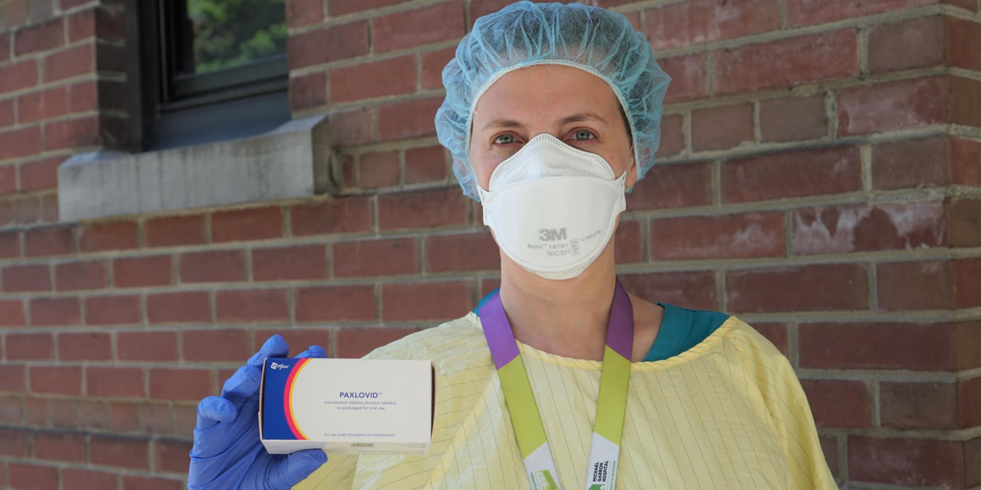 Dr. Mariana Jacubovich holds a box of Paxlovid.