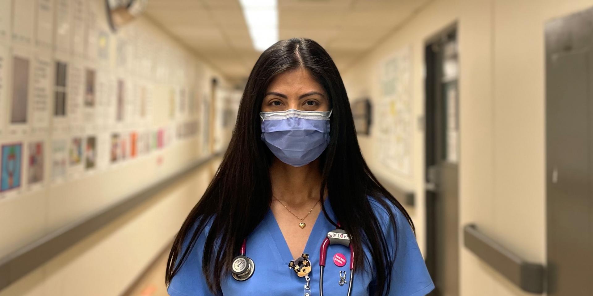 Hadia Bilal Ahmad, a nurse, stands in a hallway at Michael Garron Hospital