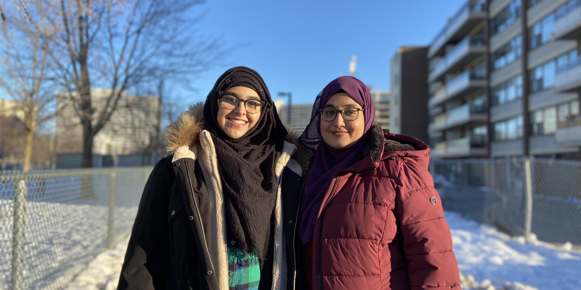 Two youth standing outside in Thorncliffe Park.