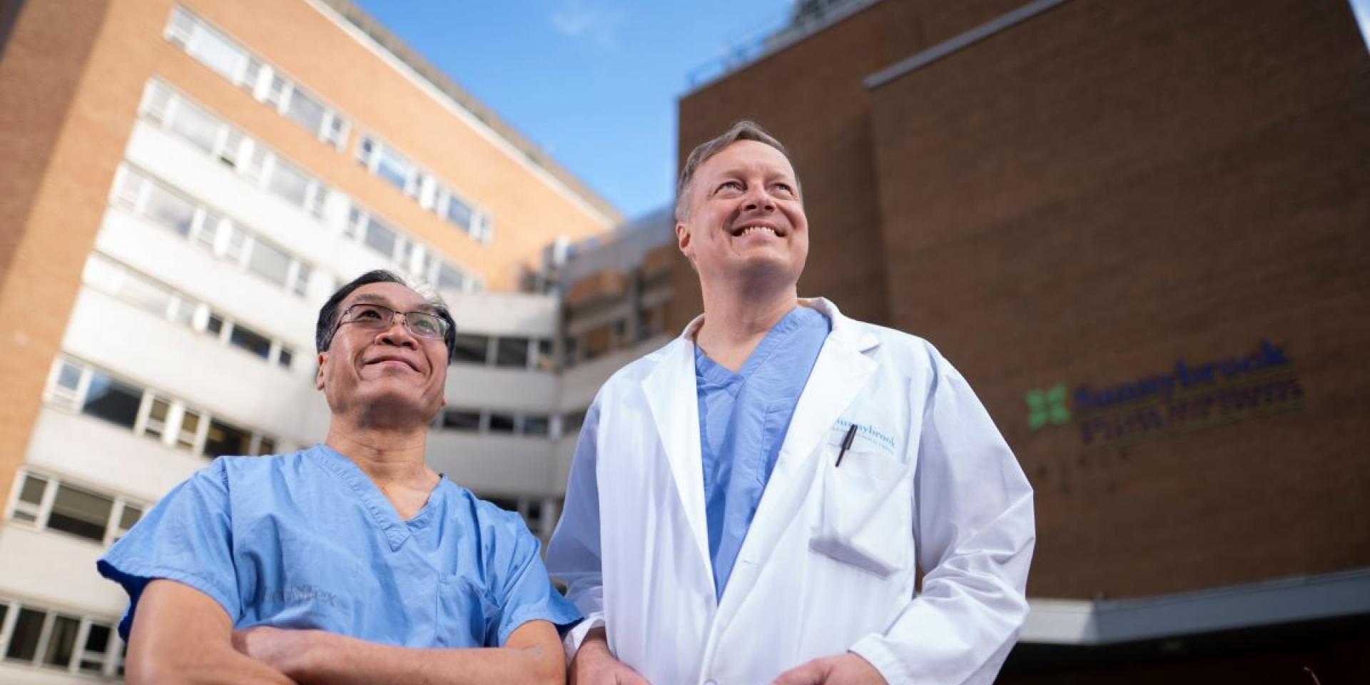 Orthopaedic surgical leads Dr. Paul Wong (Michael Garron Hospital) and Dr. Markku Nousiainien (Sunnybrook) gather outside the Holland Centre. 