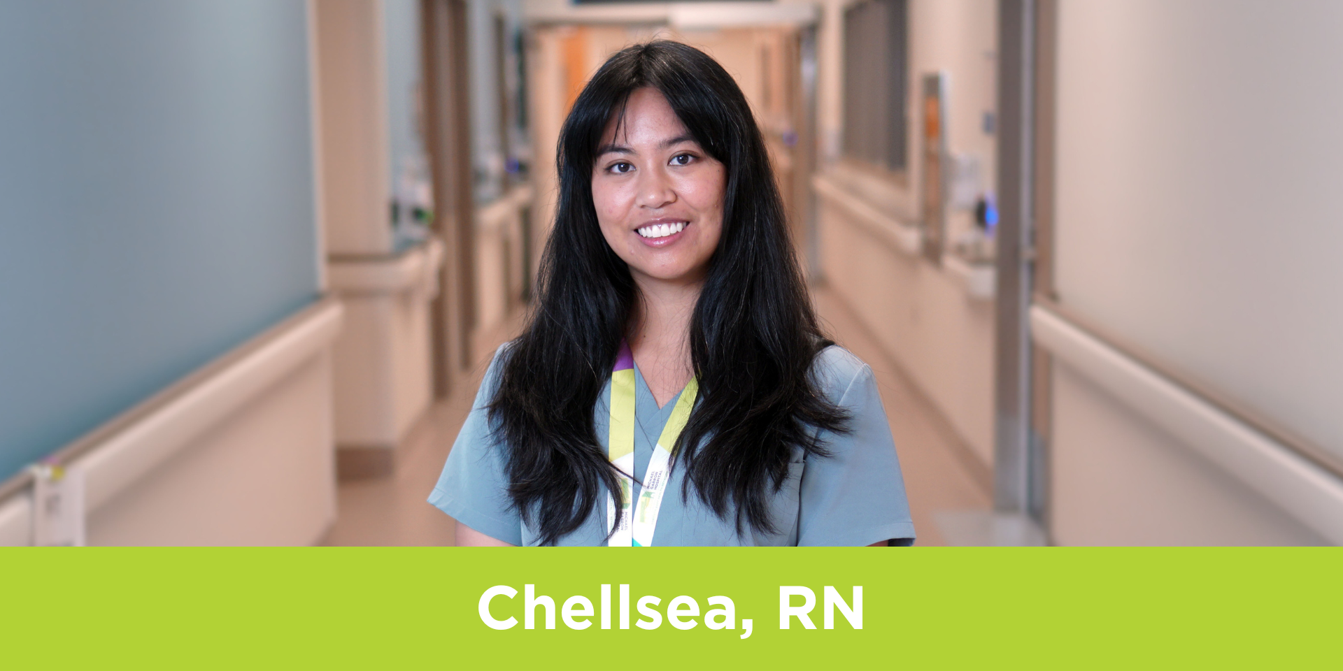 Chellsea Credo, Registered Nurse at Michael Garron Hospital, stands in a hallway.