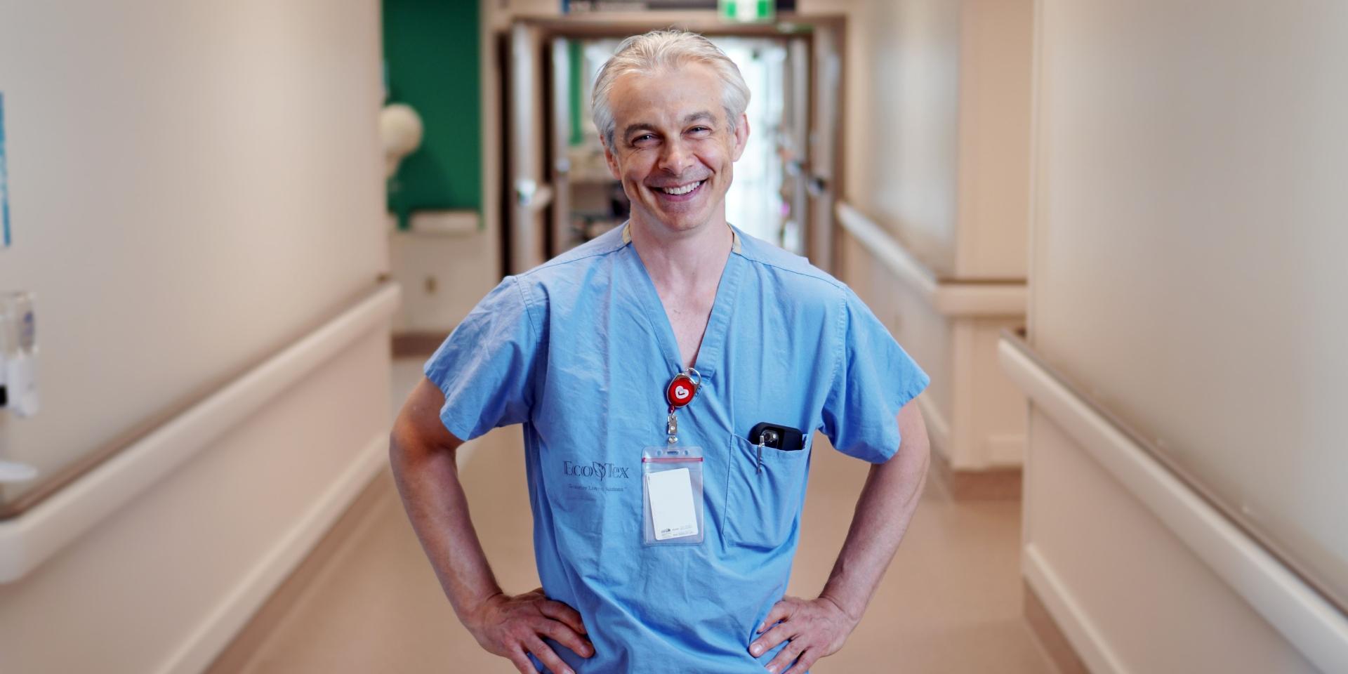 Dr. Jeff Powis smiling and standing in a hallway at MGH.