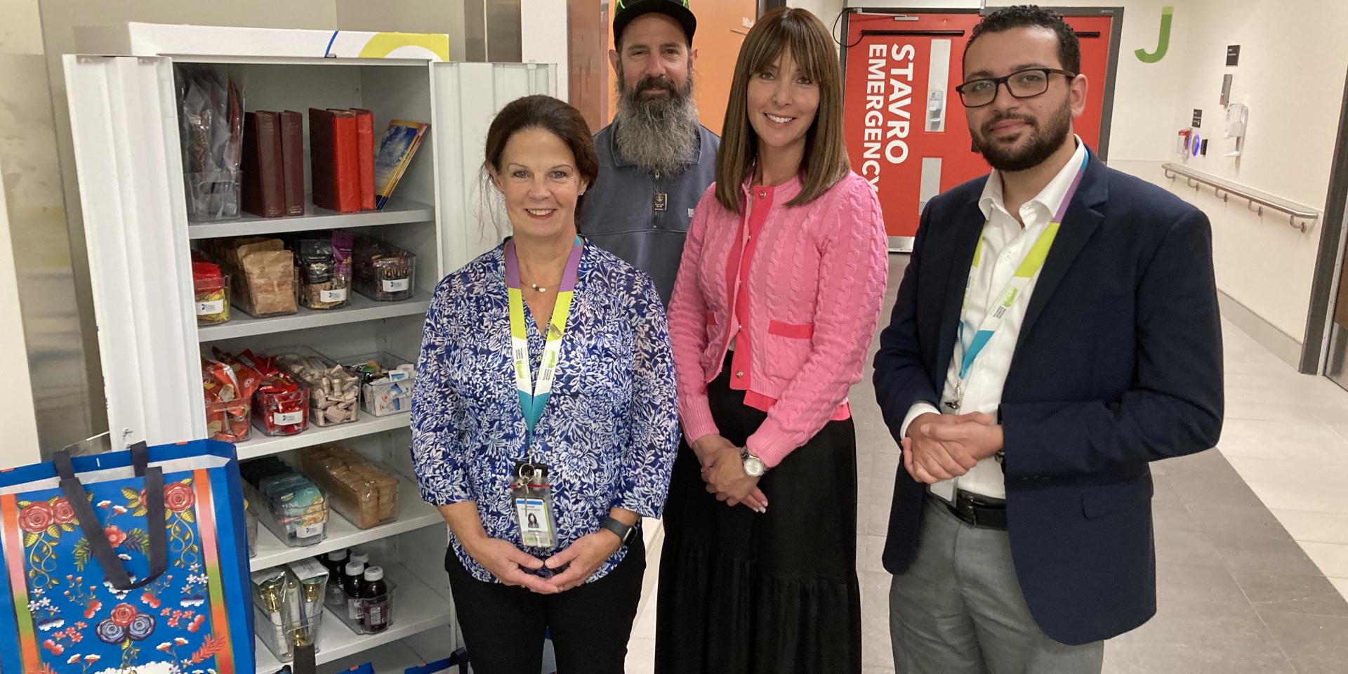 Jennifer Matheson, Director of Professional Practice at MGH, and Andrew Youssef, Spiritual Health Practitioner at MGH, accept the delivery of a new kosher cabinet from staff at Bikur Cholim. 
