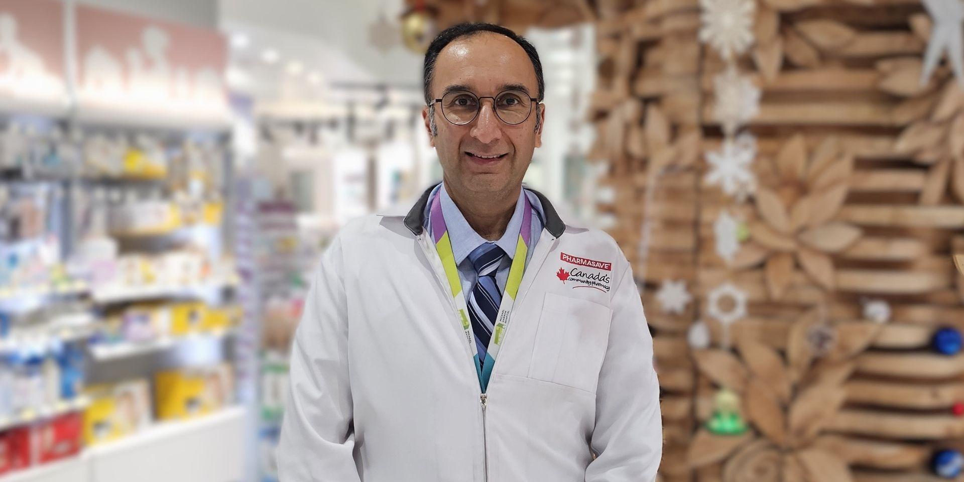 Amit standing and smiling in Pharmasave
