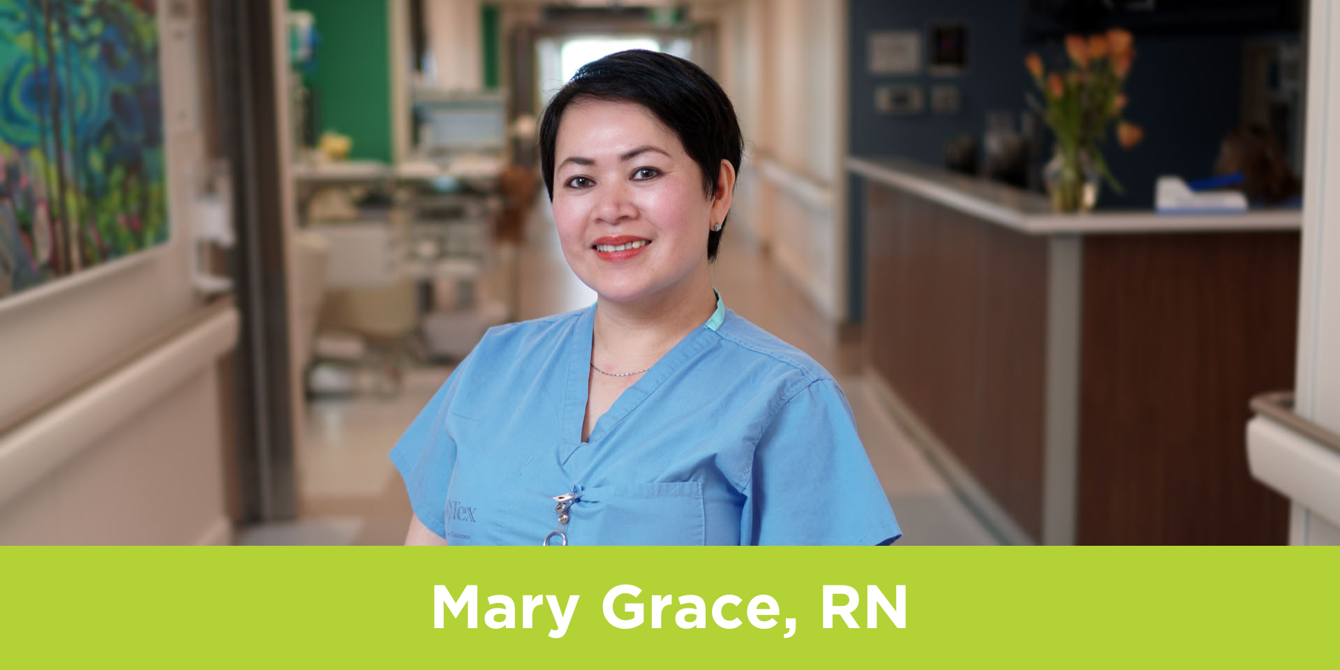 Mary Grace, a Registered Nurse, poses in a hallway at Michael Garron Hospital.