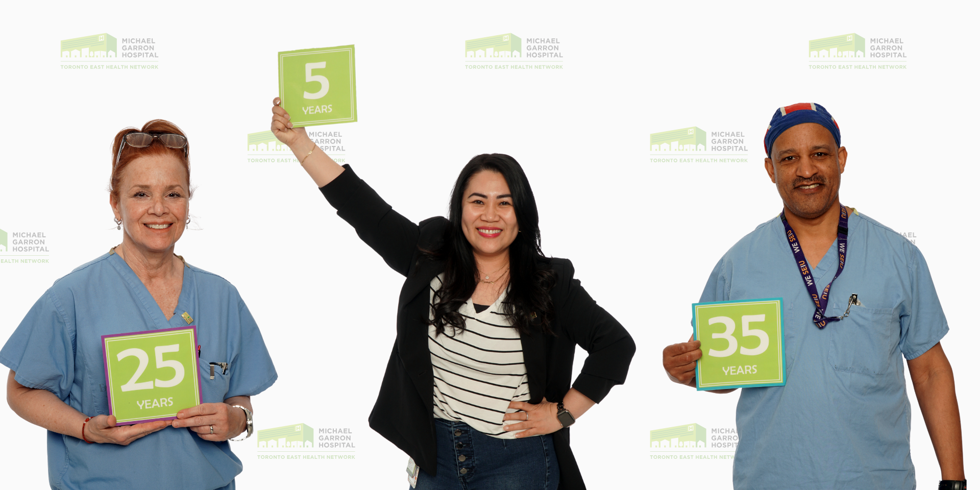 Three staff celebrating career milestones