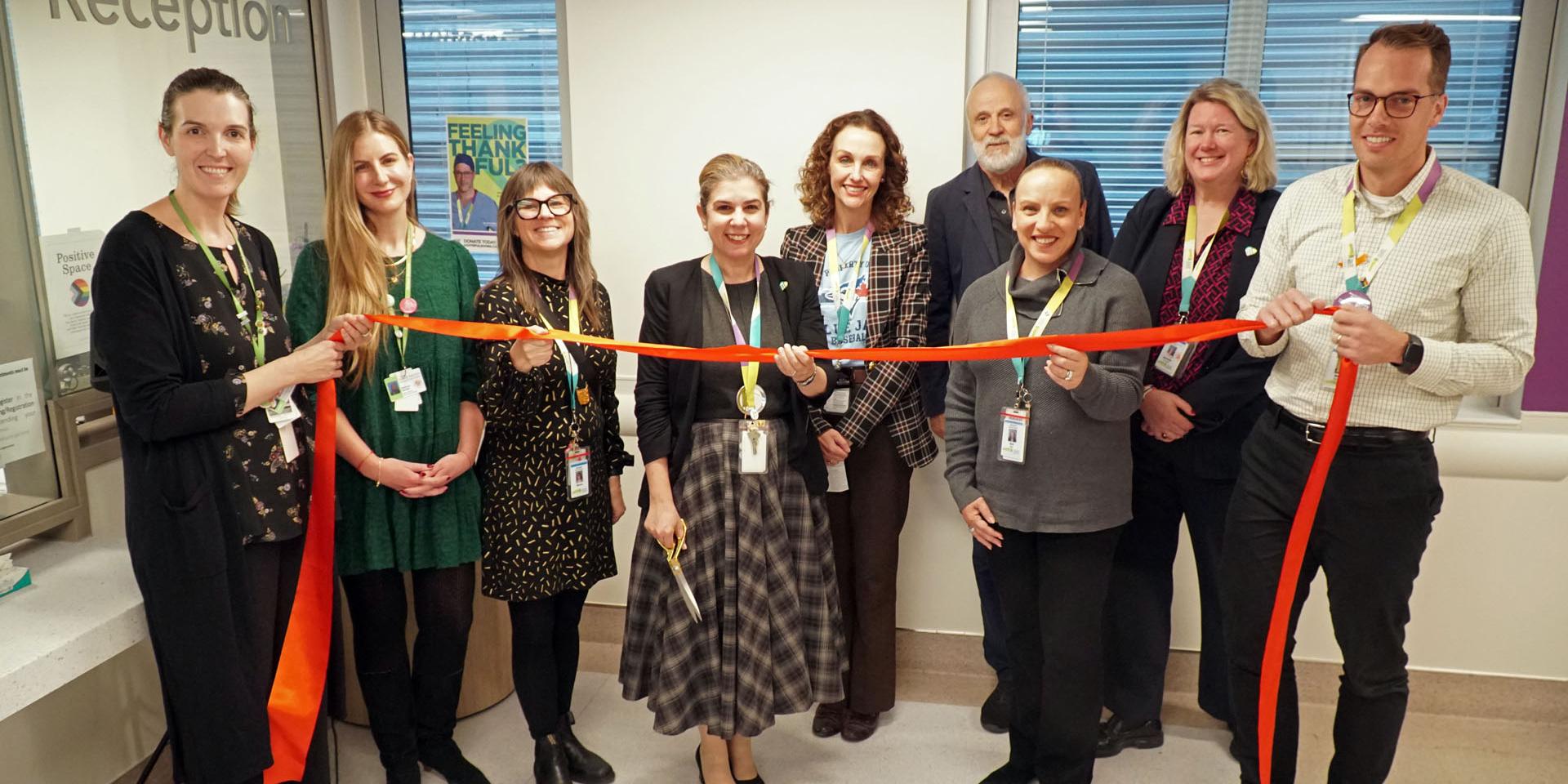MGH President and CEO Melanie Kohn cuts the ribbon for the Extensive Needs Service’s new dedicated clinical space with the MGH Mental Health and Substance Use Team and guests.