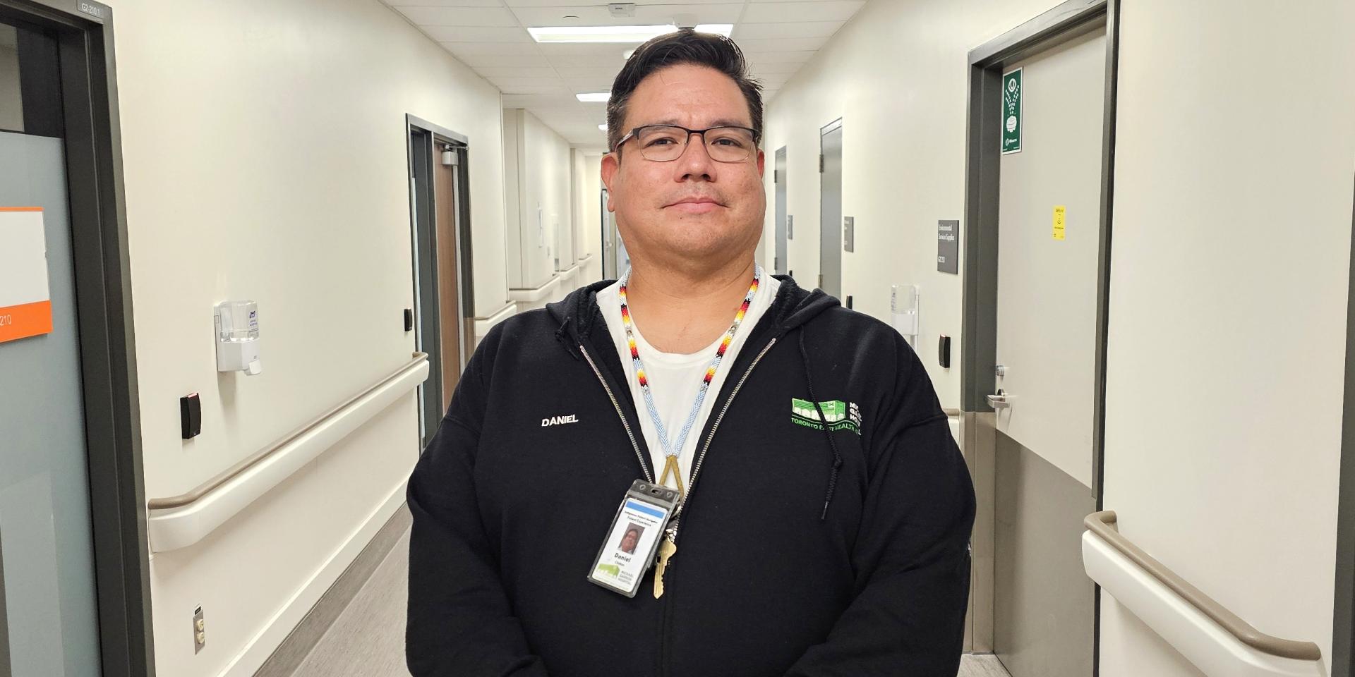 MGH's Indigenous Patient Navigator stands in a hospital hallway