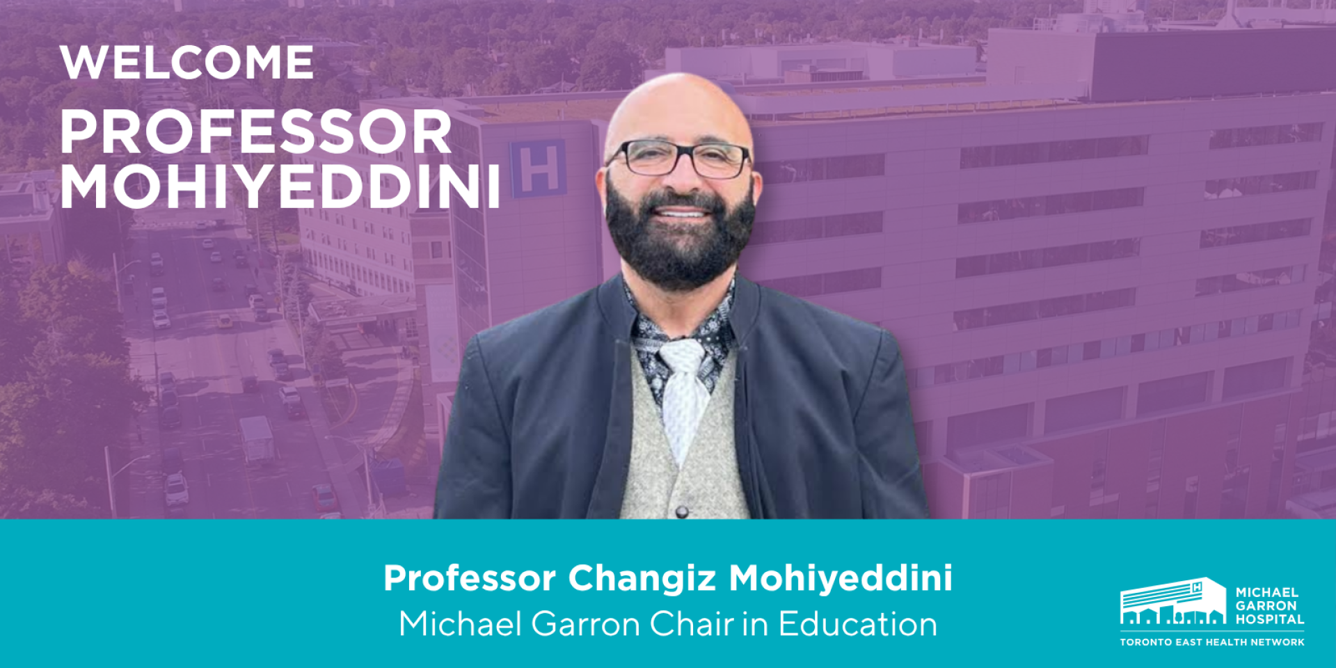 Professor Changiz Mohiyeddini, wearing a blazer and glasses, smiles at the camera. 
