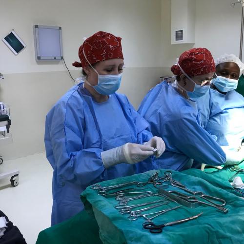 Krista Kohn, RN, assisting in a surgery. 