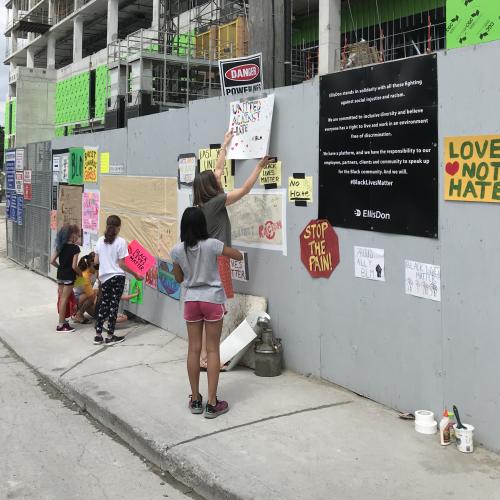 Members of the community posting signage