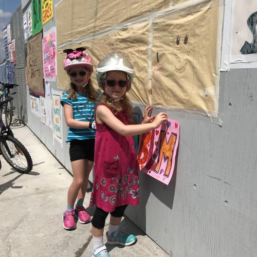 Two girls posting BLM signage