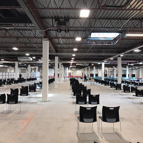 Some chairs are paired together in the observation area, so individuals with caregivers may wait alongside them.