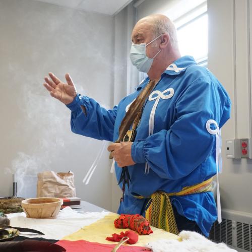 Elder Little Brown Bear conducted a sacred pipe and smudging ceremony at the clinic before it opened on March 24.