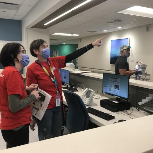 Team members setting up technology in the medicine unit of the Thomson Centre.