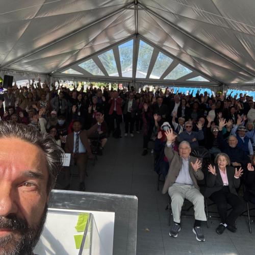 Dr. Carmine Simone, Executive Vice-President, Medical, Redevelopment, Strategic Clinical Partnerships and Innovation’s selfie with attendees cheering.