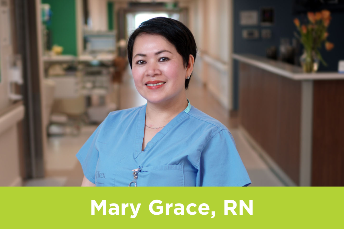 Mary Grace, a Registered Nurse, poses in a hallway at Michael Garron Hospital.