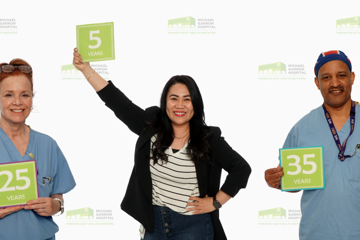 Three staff celebrating career milestones