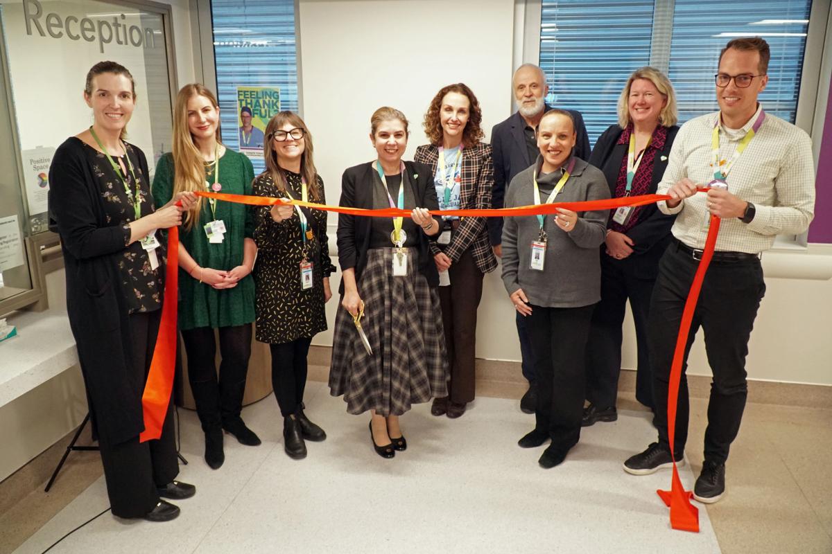 MGH President and CEO Melanie Kohn cuts the ribbon for the Extensive Needs Service’s new dedicated clinical space with the MGH Mental Health and Substance Use Team and guests.
