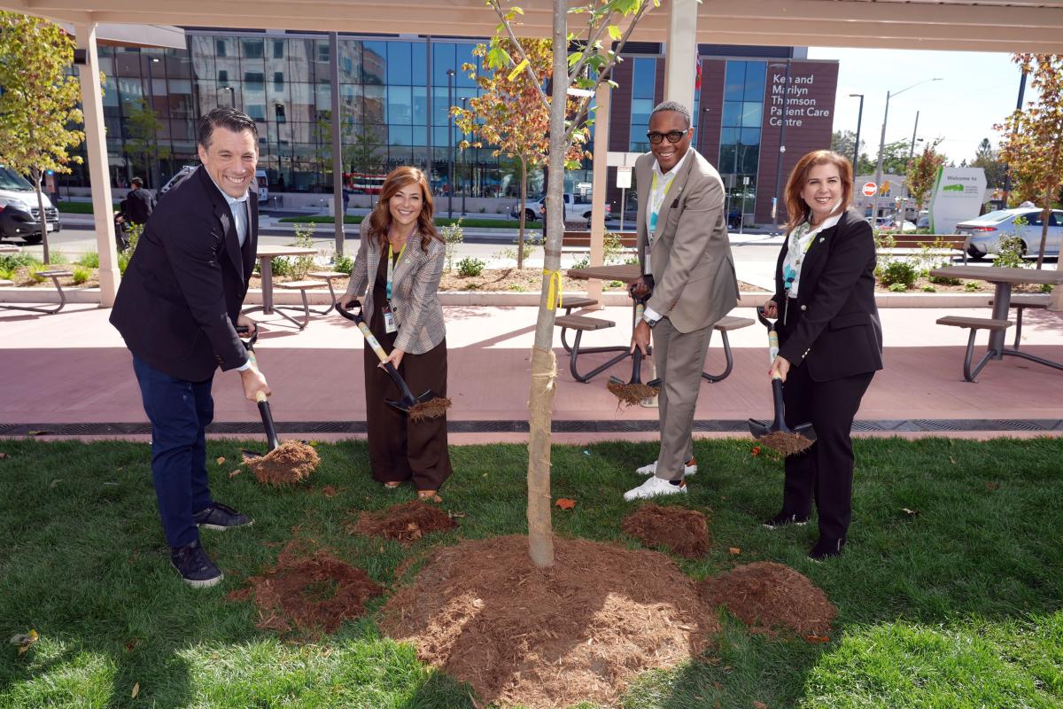 From left: Adrian Rocca, Board Chair, Michael Garron Hospital Foundation; Mitze Mourinho, President, Michael Garron Hospital Foundation; Michael Holder, Board Chair, Michael Garron Hospital; and Melanie Kohn, President and CEO, Michael Garron Hospital at the ceremonial tree planting at the celebration of Coxwell Avenue Opening.