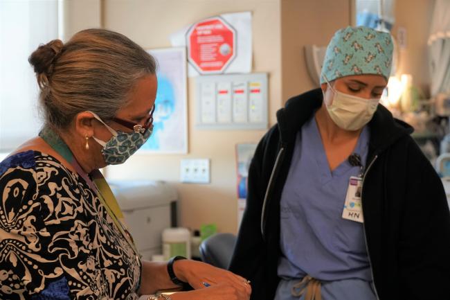 Registered nurse Stephanie Ramalho answers questions from mock surveyor Janice Ward during Rock the Mock.