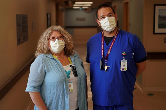 Photo of Kim Kurschinski and Daniel Chilton wearing masks