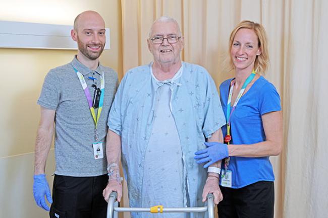 Edward Hammet exercising with MGH physiotherapist Moray Wright-Whyte and physiotherapist assistant, Courtney Gray.