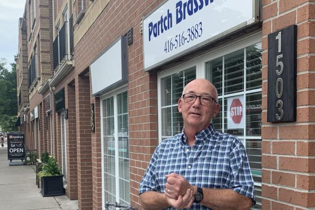 Ron Partch outside his store, Partch Brasswinds