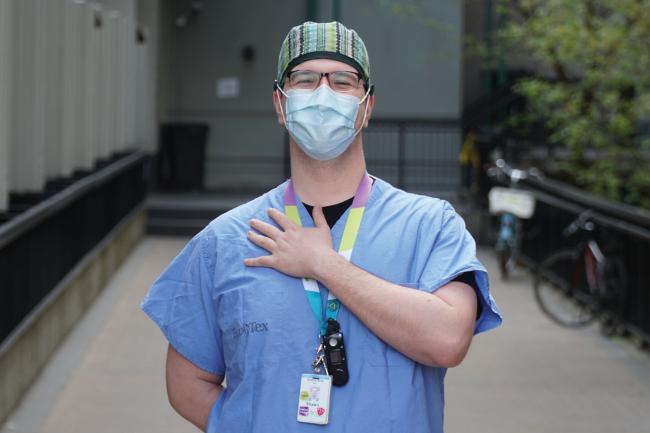 shawn palmer placing hand on heart outside staff entrance of MGH