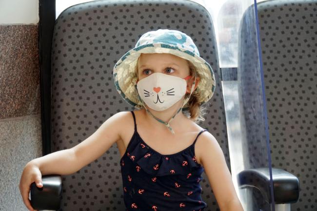 A child wearing a mask waits to be assessed at MGH's Paediatric ED COVID-19 Assessment Zone.