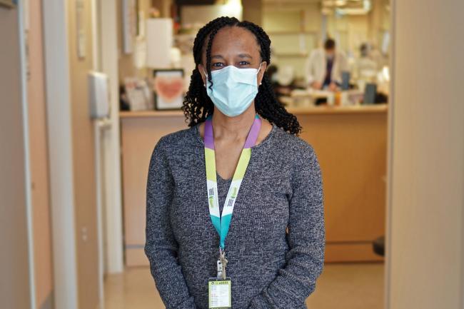 Maxine Castello, manager of renal and oncology programs at MGH, standing in a hallway