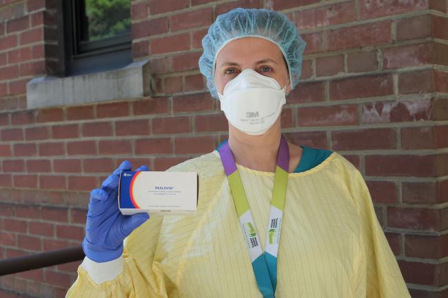 Dr. Mariana Jacubovich holds a box of Paxlovid.