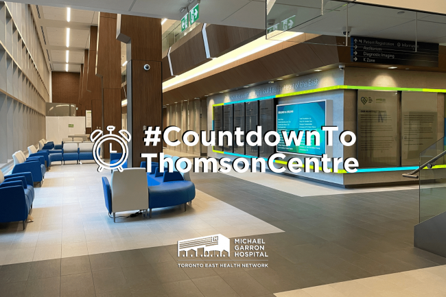 Wide shot of the main lobby in the new Thomson Centre with overlay text that reads "#CountdowntoThomsonCentre" with an alarm emote on the left. MGH logo is underneath it