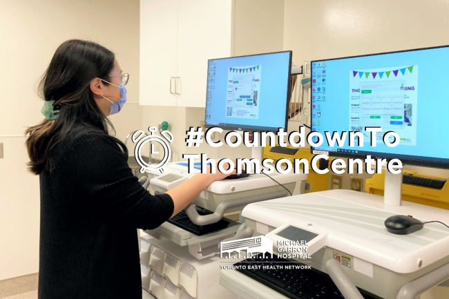 A staff member uses a medication cart at MGH