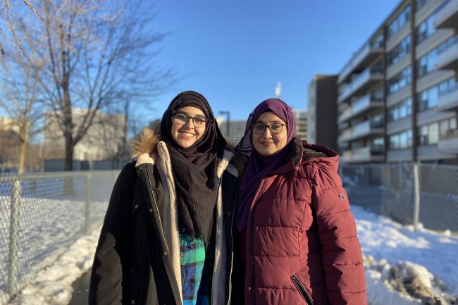 Two youth standing outside in Thorncliffe Park.