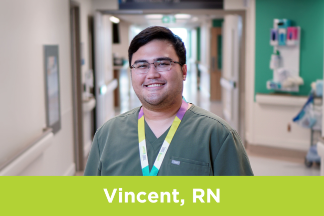 Vincent Matthew Completo, RN at Michael Garron Hospital, stands in a hallway.