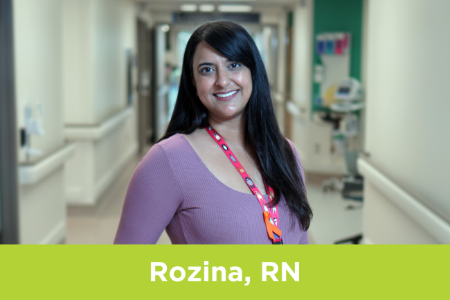 Rozina Ramrattan, Registered Nurse at Michael Garron Hospital, poses in a hallway.