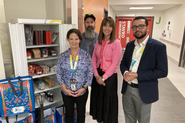 Jennifer Matheson, Director of Professional Practice at MGH, and Andrew Youssef, Spiritual Health Practitioner at MGH, accept the delivery of a new kosher cabinet from staff at Bikur Cholim. 
