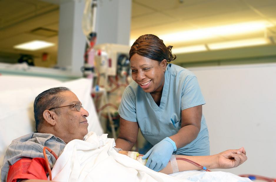 Healthcare professional tending to patient