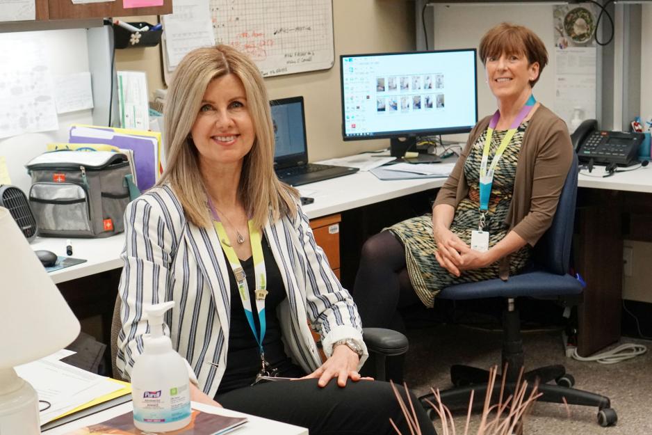 Trudy Ryan-Brady and Mary Fitzgerald sitting at their office computers