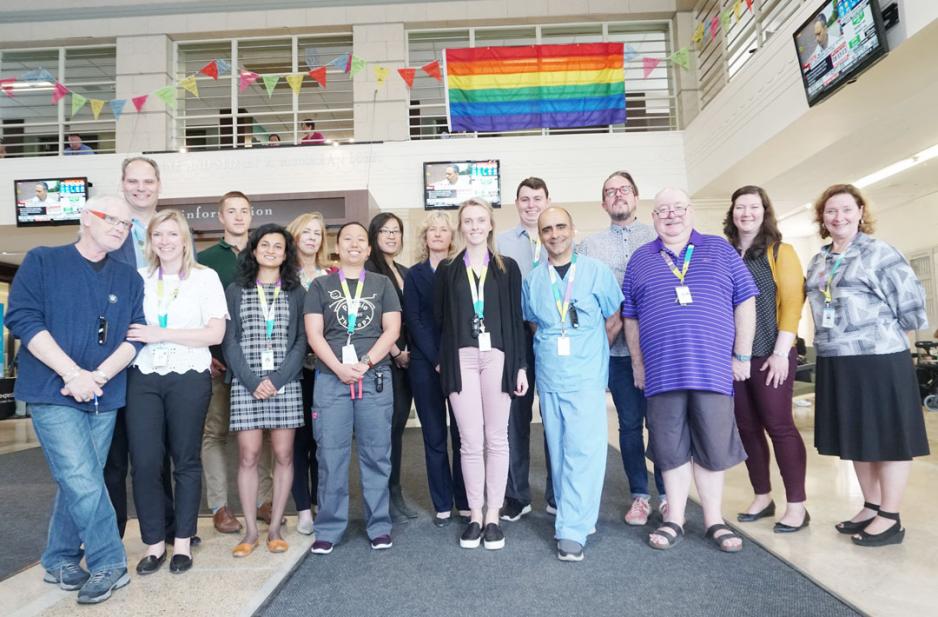 MGH staff gather in the Coxwell lobby to raise the Pride flag in honour of Pride month. (Photo: Ellen Samek)