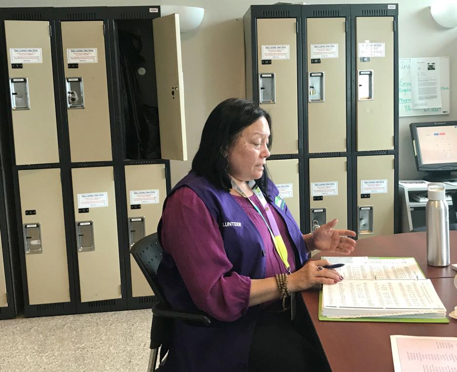 Allison rehearsing before the choir goes on its rounds throughout the hospital.