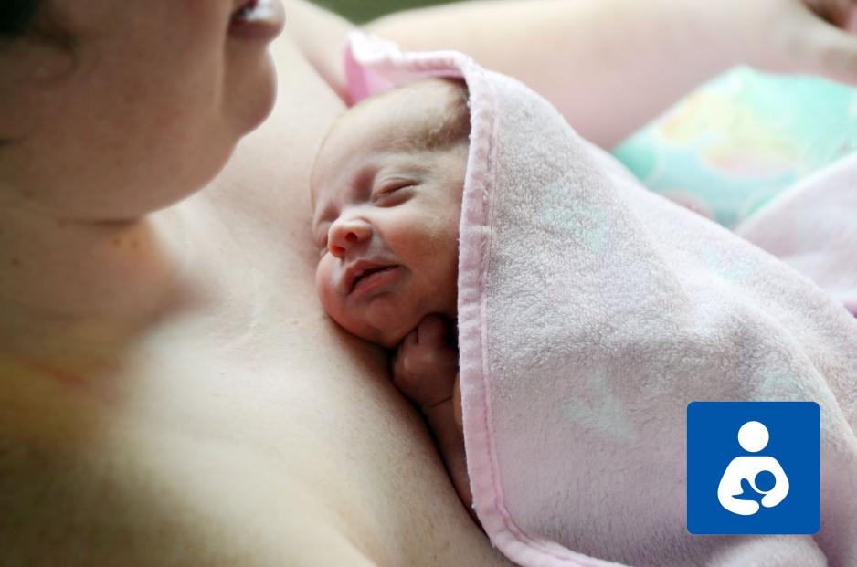 Newborn baby sleeping on parent's chest